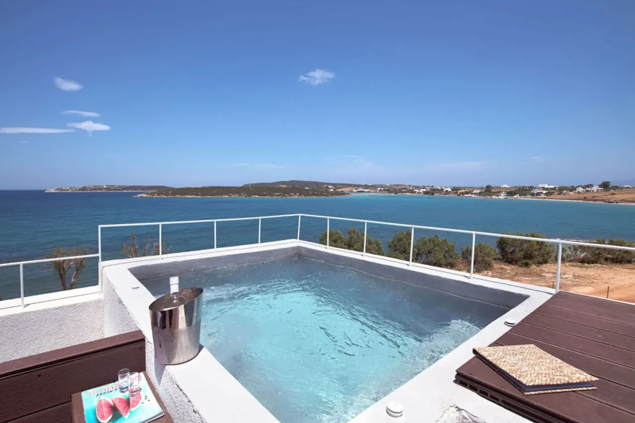 Outdoor jetted tub on the terrace of the 360° Double Suite with panoramic views over Naoussa bay